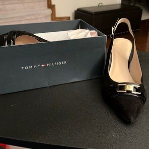 Black sling backs with gold buckle bow in the front.